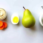 Three examples of balanced "Protein + Produce" snacks: vegetables with hummus, egg with pear, yogurt with berries.