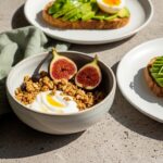 chic morning breakfast scene on a textured greige stone table